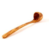 Extra long olive wood ladle on a white background