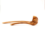 Side view of two wooden ladles on a white background