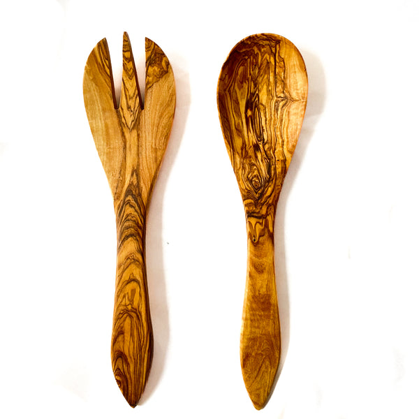 Large olive wood serving fork and serving spoon on a white background