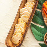 Naan bites in a wooden cracker tray