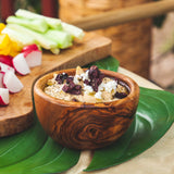 Wood bowl filled with hummus