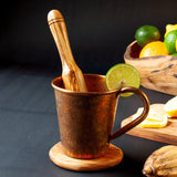 Olive Wood Muddler with Copper Mug and citrus fruit