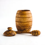 Wood Honey Jar on a white background with lid removed and honey dipper 