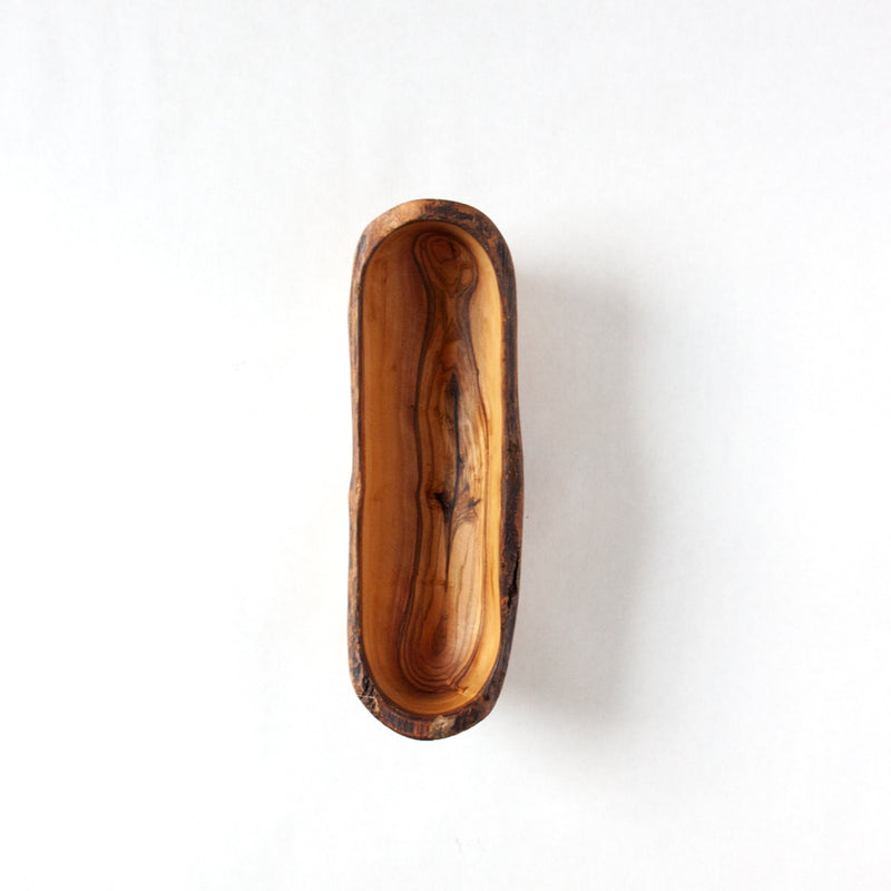 top down view of a wooden bowl for crackers, empty and on a white background