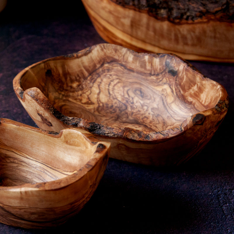 Wooden dish with live edge on a dark background