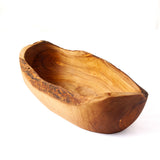 A rustic handcrafted wooden bowl with a natural live edge and rich wood grain, photographed on a clean white background.