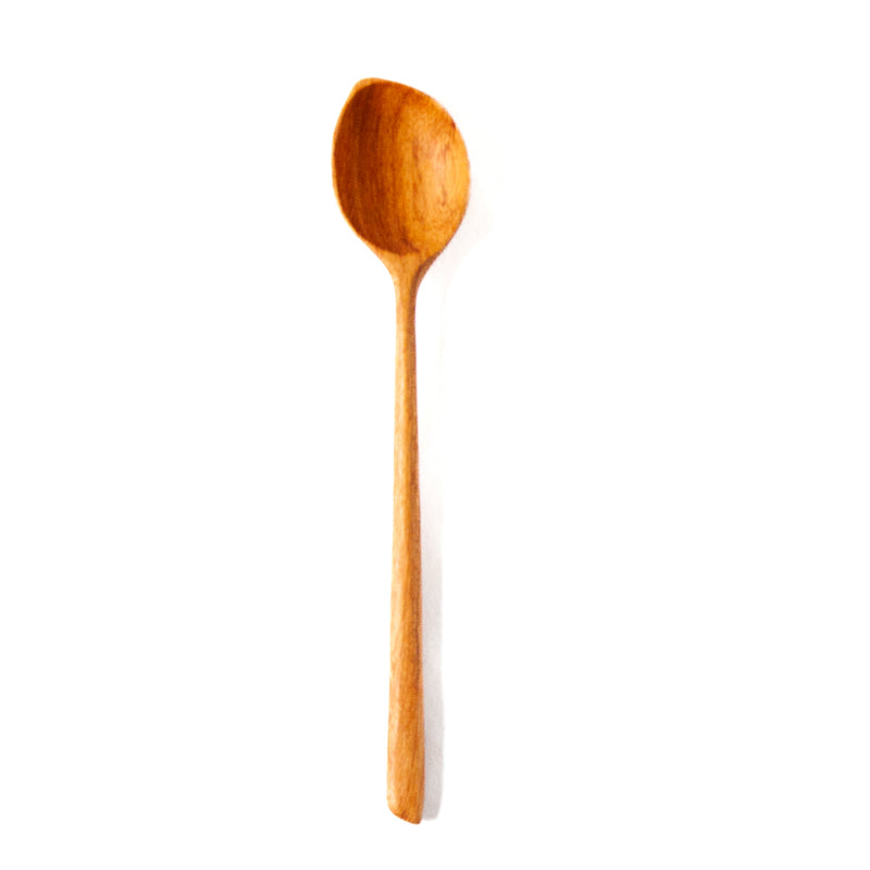 white dip spoon with pointed edge on a white background