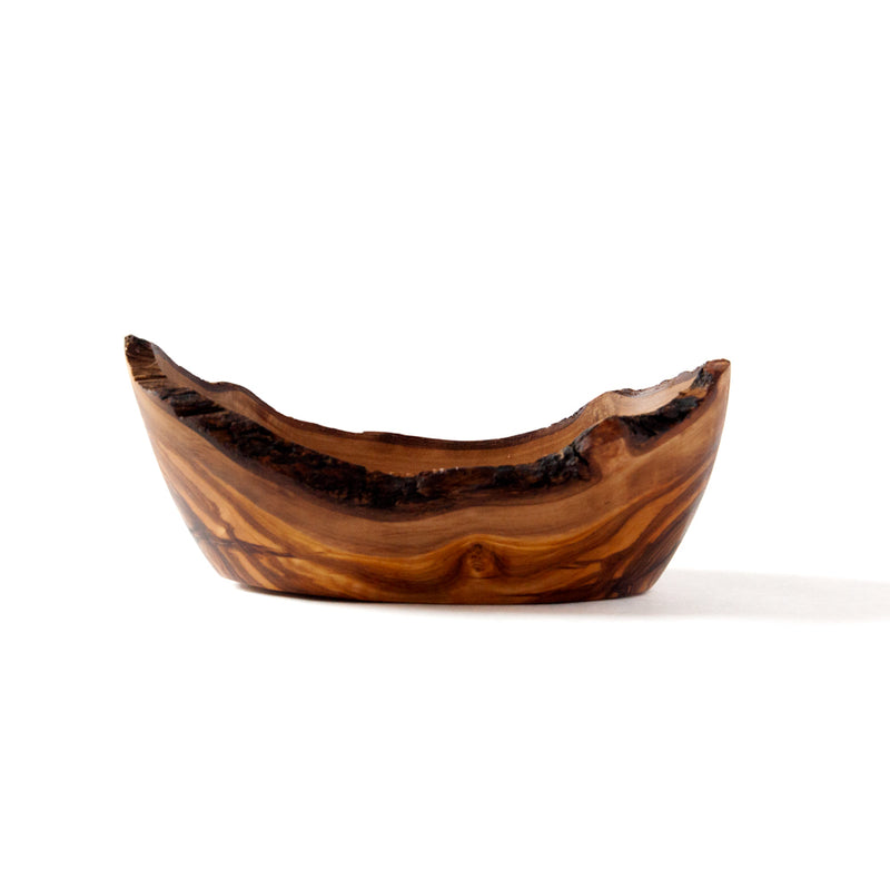 side view of a rustic olive wood dish, empty, on a white background