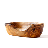 white background with small wooden dish with live edge