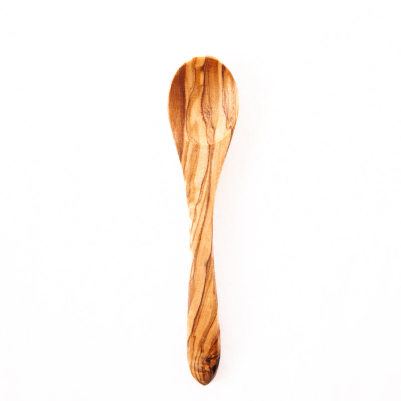 Small wooden spoon on white background