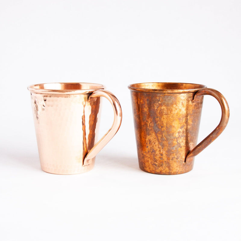 Shiny copper mug and patina copper mug