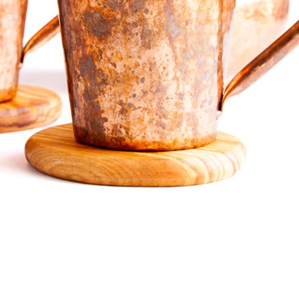 Round Wooden Coasters with a copper mug