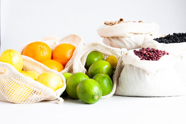 Reusable Grocery Bags with dried pantry items and citrus