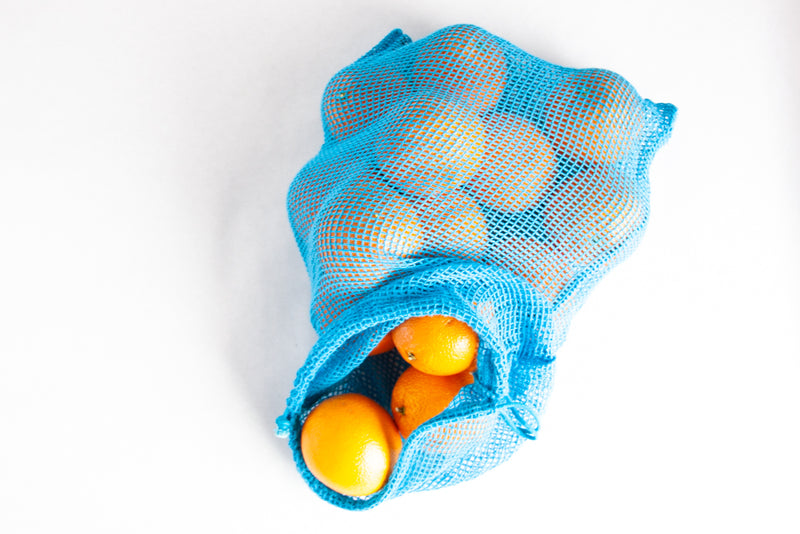oranges in a reusable produce bag
