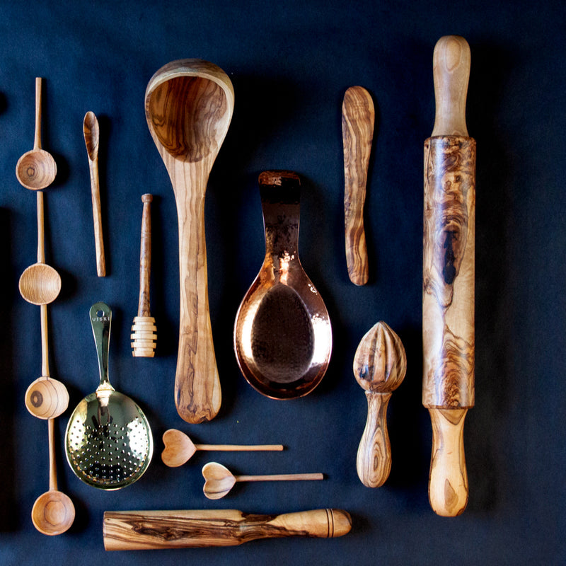 wooden and copper kitchen utensils